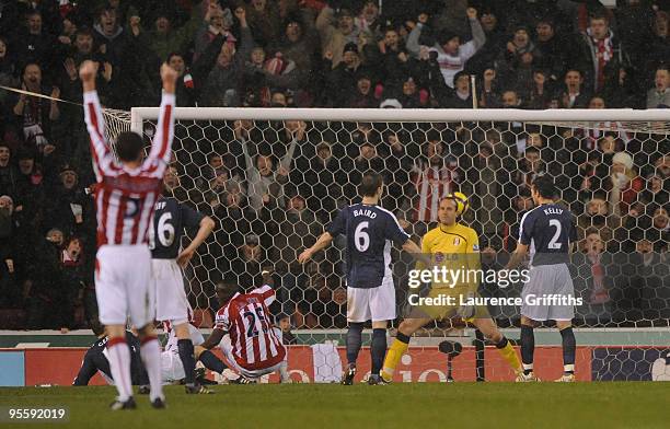 Abdoulaye Faye of Stoke scores past Mark Schwarzer of Fulham during the Barclays Premier League match between Stoke City and Fulham at The Britannia...