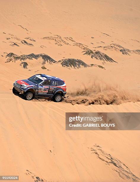 France's Stephane Peterhansel steers his BMW during the 4th stage of the Dakar 2010 between Fiambala, Argentina, and Copiapo, Chile, on January 5,...