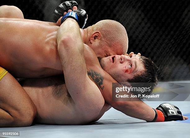 Fighter Tito Ortiz battles Forrest Griffin during their Light Heavyweight Fight at UFC 106: Ortiz vs. Griffin 2 at Mandalay Bay Events Center on...