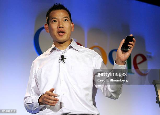 Erick Tseng, senior product manager for Google Inc., holds up the Google Nexus One touch-screen mobile phone during a news conference at Google...