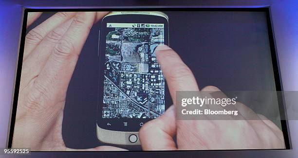Screen shot of the Google Earth application on Google Inc.'s Nexus One smartphone, is displayed at the unveiling of the Nexus One during a news...