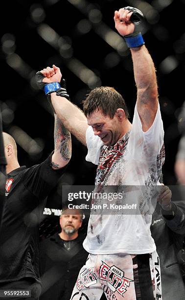Fighter Forrest Griffin celebrates after defeating UFC fighter Tito Ortiz during their Light Heavyweight Fight at UFC 106: Ortiz vs. Griffin 2 at...