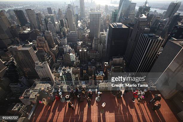 Visitors take in the view at Top of the Rock Observation Deck at 30 Rockefeller Plaza January 5, 2010 in New York City. New York City overtook...