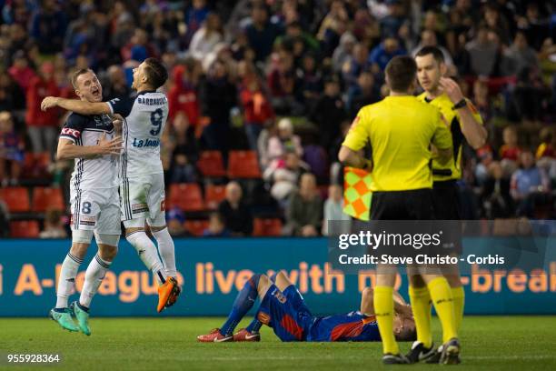 Besart Berisha and Kosta Barbarouses of Melbourne Victory celebrate winning the 2018 A-League Grand Final match between the Newcastle Jets and the...