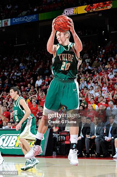 Quinn McDowell of the William and Mary Tribe grabs a rebound against the Maryland Terrapins at the Comcast Center on December 30, 2009 in College...