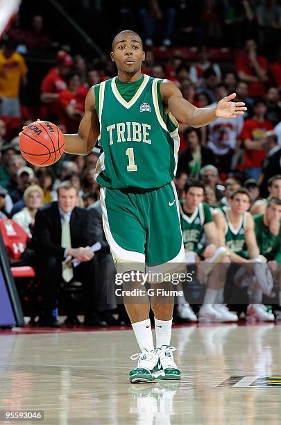 Kendrix Brown of the William and Mary Tribe plays handles the ball against the Maryland Terrapins at the Comcast Center on December 30, 2009 in...