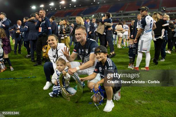 Besart Berisha of Melbourne Victory poses for photographers with his family after winning the 2018 A-League Grand Final match between the Newcastle...