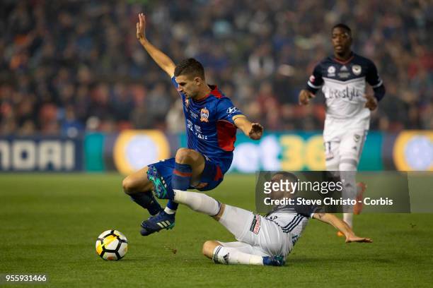 James Troisi of Melbourne Victory challenges Jets Steven Ugarkovic the 2018 A-League Grand Final match between the Newcastle Jets and the Melbourne...
