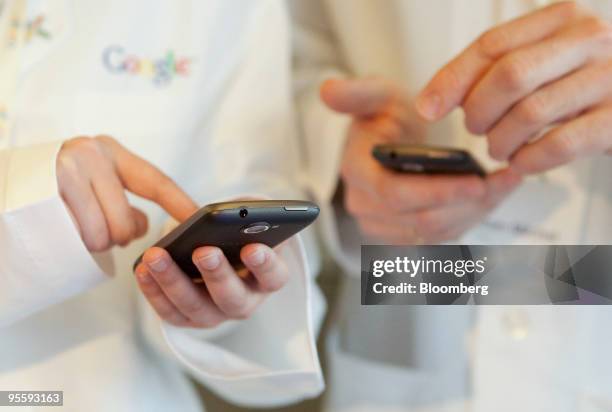 Google Inc. Nexus One touch-screen mobile phones are displayed for the media at Google headquarters in Mountain View, California, U.S., on Tuesday,...