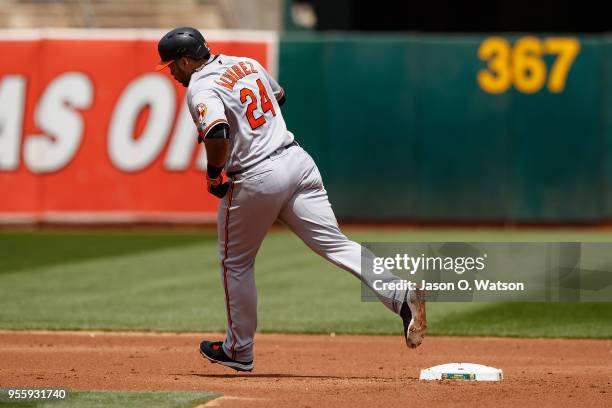 Pedro Alvarez of the Baltimore Orioles rounds the bases after hitting a home run against the Oakland Athletics during the second inning at the...