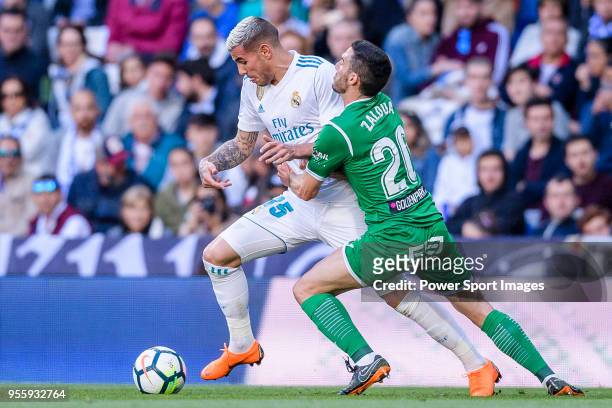Theo Hernandez of Real Madrid fights for the ball with Joseba Zaldua Bengoechea of CD Leganes during the La Liga 2017-18 match between Real Madrid...