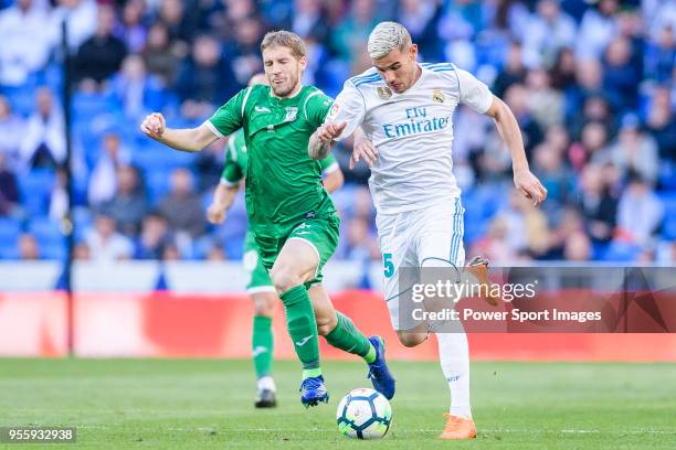 Theo Hernandez of Real Madrid fights for the ball with Darko Brasanac of CD Leganes during the La Liga 2017-18 match between Real Madrid and CD...