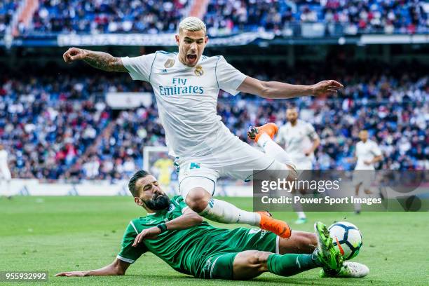 Theo Hernandez of Real Madrid fights for the ball with Dimitrios Siovas of CD Leganes during the La Liga 2017-18 match between Real Madrid and CD...