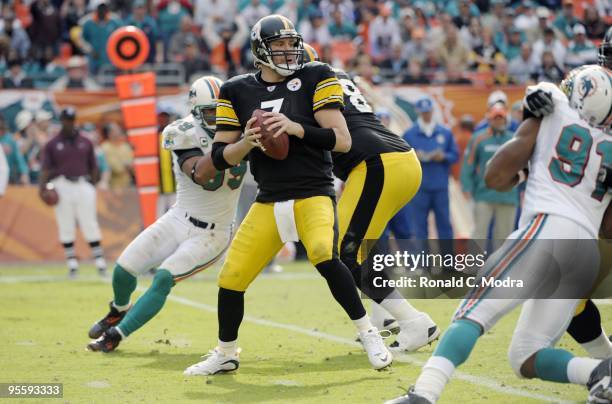 Quarterback Ben Roethlisberger of the Pittsburgh Steelers looks for a receiver during a NFL game against the Miami Dolphins at Land Shark Stadium on...