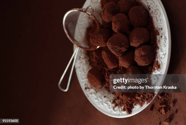 cinnamon-cognac truffles - straining spoon stock pictures, royalty-free photos & images