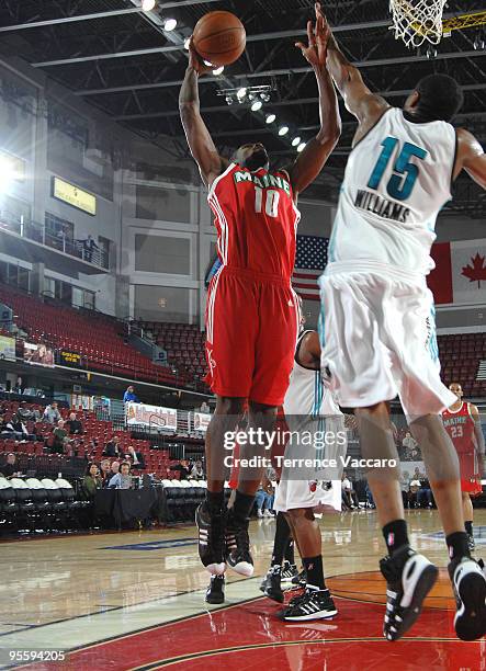 Abdulai Jalloh of the Maine Red Claws goes to the basket against Reggie Williams of the Sioux Falls Skyforce during the 2010 D-League Showcase at...