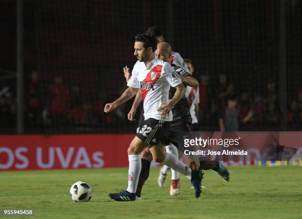 Ignacio Scocco of River Plate fights for the ball with Matias Fritzler of Colon during a match between Colon and River Plate as part of Superliga at...