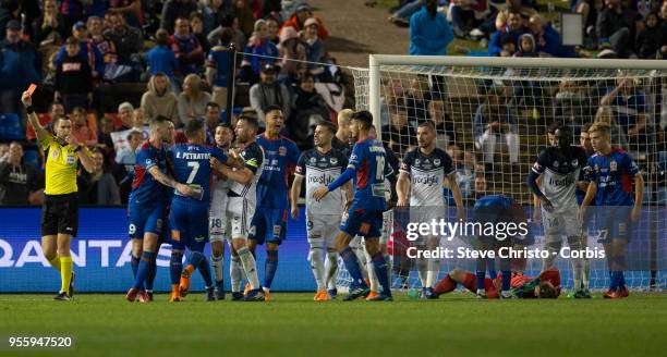 Referee Jarred Gillett gives Roy O'Donovan of the Jets a red card following his collision with Lawrence Thomas of the Victory during the 2018...