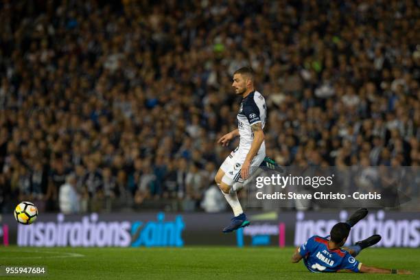 James Troisi of Melbourne Victory jumps in this challenge from Jets Ronald Vargas during the 2018 A-League Grand Final match between the Newcastle...