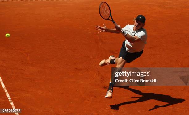 Denis Shapovalov of Canada plays a forehand against Benoit Paire of France in their second round match during day four of the Mutua Madrid Open...