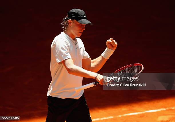 Denis Shapovalov of Canada celebrates match point against Benoit Paire of France in their second round match during day four of the Mutua Madrid Open...