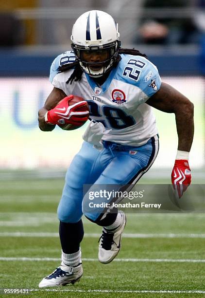 Chris Johnson of the Tennessee Titans runs with the ball against the Seattle Seahawks at Qwest Field on January 3, 2010 in Seattle, Washington....