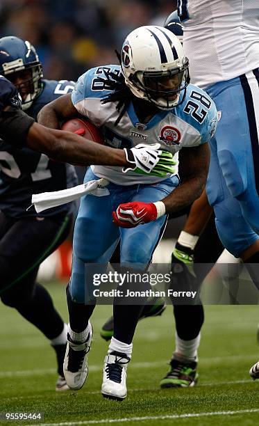 Chris Johnson of the Tennessee Titans runs with the ball against the Seattle Seahawks at Qwest Field on January 3, 2010 in Seattle, Washington....