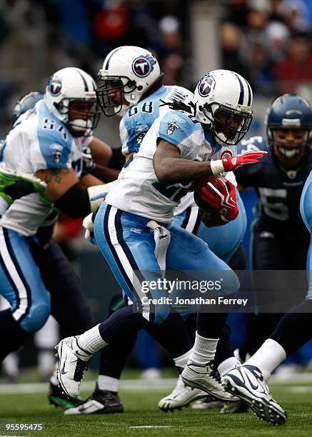 Chris Johnson of the Tennessee Titans runs with the ball against the Seattle Seahawks at Qwest Field on January 3, 2010 in Seattle, Washington....