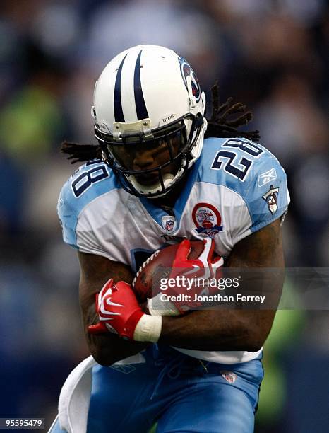 Chris Johnson of the Tennessee Titans runs with the ball against the Seattle Seahawks at Qwest Field on January 3, 2010 in Seattle, Washington....