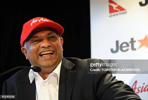 AirAsia CEO Tony Fernandes announces plans to slash costs and ticket prices by pooling with Australia's JetStar during a press conference in Sydney...