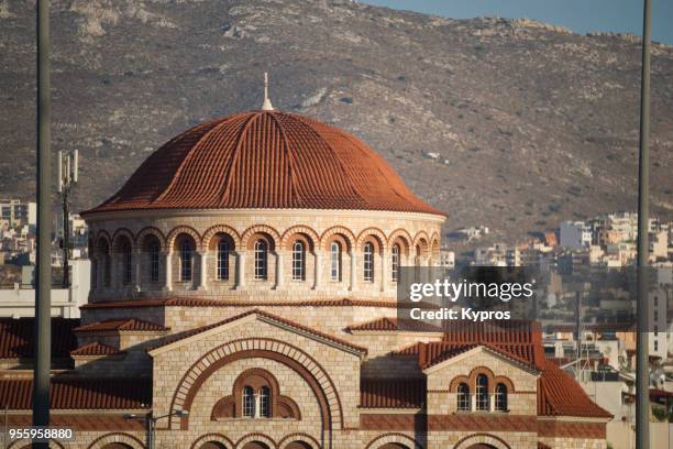 europe, greece, athens area, piraeus port, 2017: view of church - grieks orthodox stockfoto's en -beelden