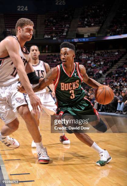 Brandon Jennings of the Milwaukee Bucks drives against Brook Lopez of the New Jersey Nets during the game on January 5, 2010 at the Izod Center in...