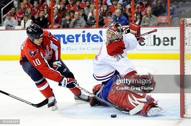 Carey Price of the Montreal Canadiens makes a save against Matt Bradley of the Washington Capitals at the Verizon Center on January 5, 2010 in...