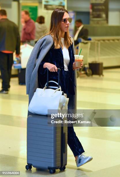 Jessica Alba seen out in JFK Airport in Queens on May 7, 2018 in New York City.