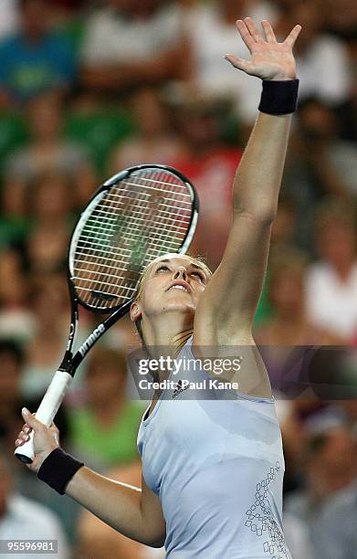 Sabine Lisicki of Germany serves in her match against Laura Robson of Great Britain in the Group B match between Great Britain and Germany during day...