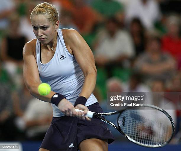 Sabine Lisicki of Germany plays a backhand shot in her match against Laura Robson of Great Britain in the Group B match between Great Britain and...