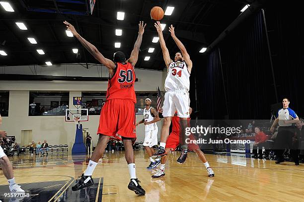 Rodney Webb of the Bakersfield Jam shoots over Cedric Simmons of the Idaho Stampede during the D-League game on December 19, 2009 at Jam Events...