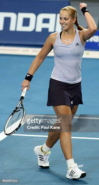 Sabine Lisicki of Germany celebrates defeating Laura Robson of Great Britain in the Group B match between Great Britain and Germany during day five...