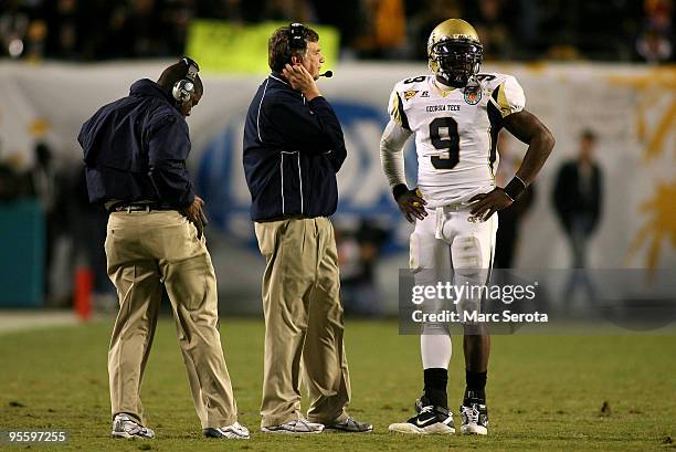 Head coach Paul Johnson of the Georgia Tech Yellow Jackets talks with quarterback Josh Nesbitt against the Iowa Hawkeyes during the FedEx Orange Bowl...