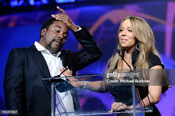 Director Lee Daniels presents singer Mariah Carey with the Breakthrough Actress Performance award onstage at the 2010 Palm Springs International Film...