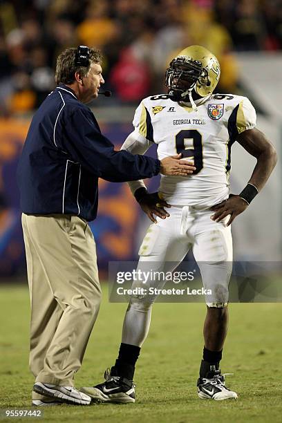 Head coach Paul Johnson of the Georgia Tech Yellow Jackets talks with quarterback Josh Nesbitt against the Iowa Hawkeyes during the FedEx Orange Bowl...