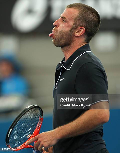 Marc Gicquel of France pokes out his tongue after losing a point in his second round match against James Blake of the USA during day four of the...
