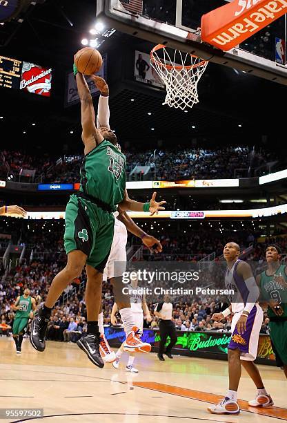 Shelden Williams of the Boston Celtics puts up a shot during the NBA game against the Phoenix Suns at US Airways Center on December 30, 2009 in...