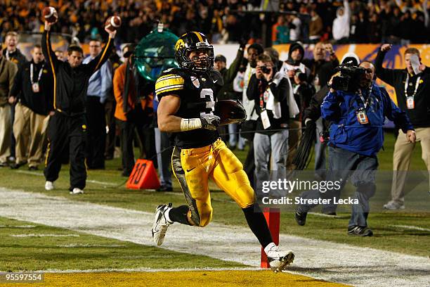 Brandon Wegher of the Iowa Hawkeyes scores a 32-yard rushing touchdown late in the fourth quarter against the Georgia Tech Yellow Jackets during the...