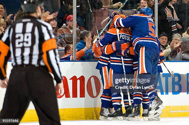 Ladislav Smid, Ryan Potulny of the Edmonton Oilers celebrate a goal against the Phoenix Coyotes at Rexall Place on January 5, 2010 in Edmonton,...