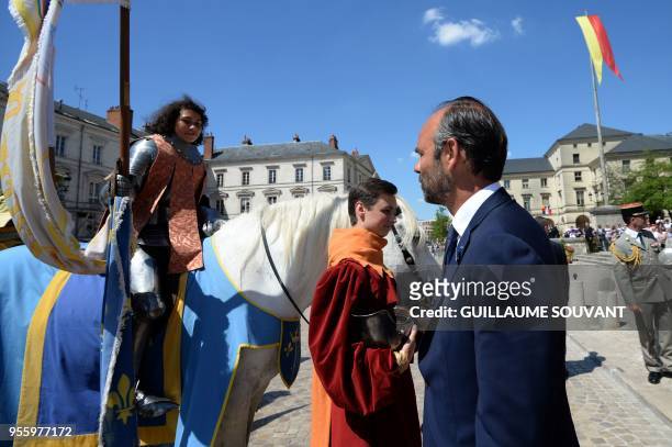 French prime minister Edouard Philippe meets Mathilde Edey Gamassou acting as Jeanne d'Arc during the Johannique celebrations, celebrations in...