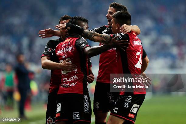 Miler Bolanos of Tijuana celebrates with teammates after scoring the second goal of his team during the quarter finals second leg match between...