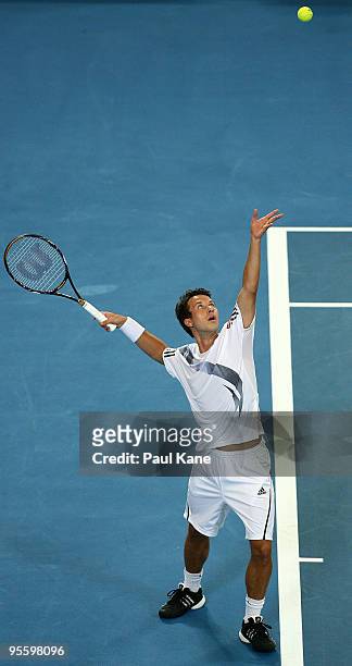 Philipp Kohlschreiber of Germany serves in his match against Andy Murray of Great Britain in the Group B match between Great Britain and Germany...
