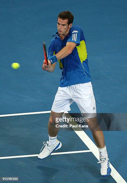 Andy Murray of Great Britain plays a backhand shot in his match against Philipp Kohlschreiber of Germany in the Group B match between Great Britain...
