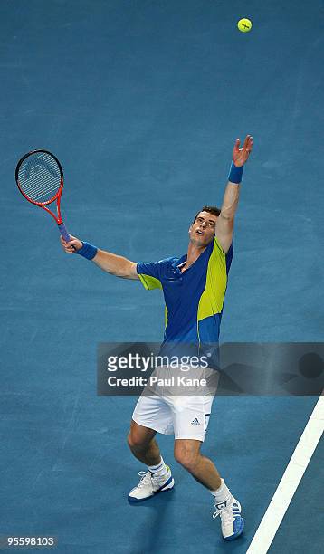 Andy Murray of Great Britain serves in his match against Philipp Kohlschreiber of Germany in the Group B match between Great Britain and Germany...